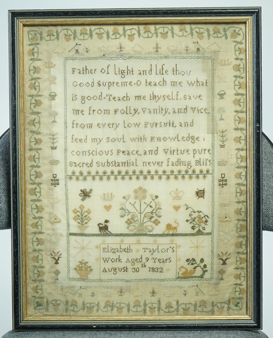 A framed needlework sampler, dated August 30th 1832 by Elizabeth Taylor. Worked with large verse, with panel beneath of spot motifs a dog and lion, two crowns and hearts, butterfly, bee bird in a tree and flower in a vas